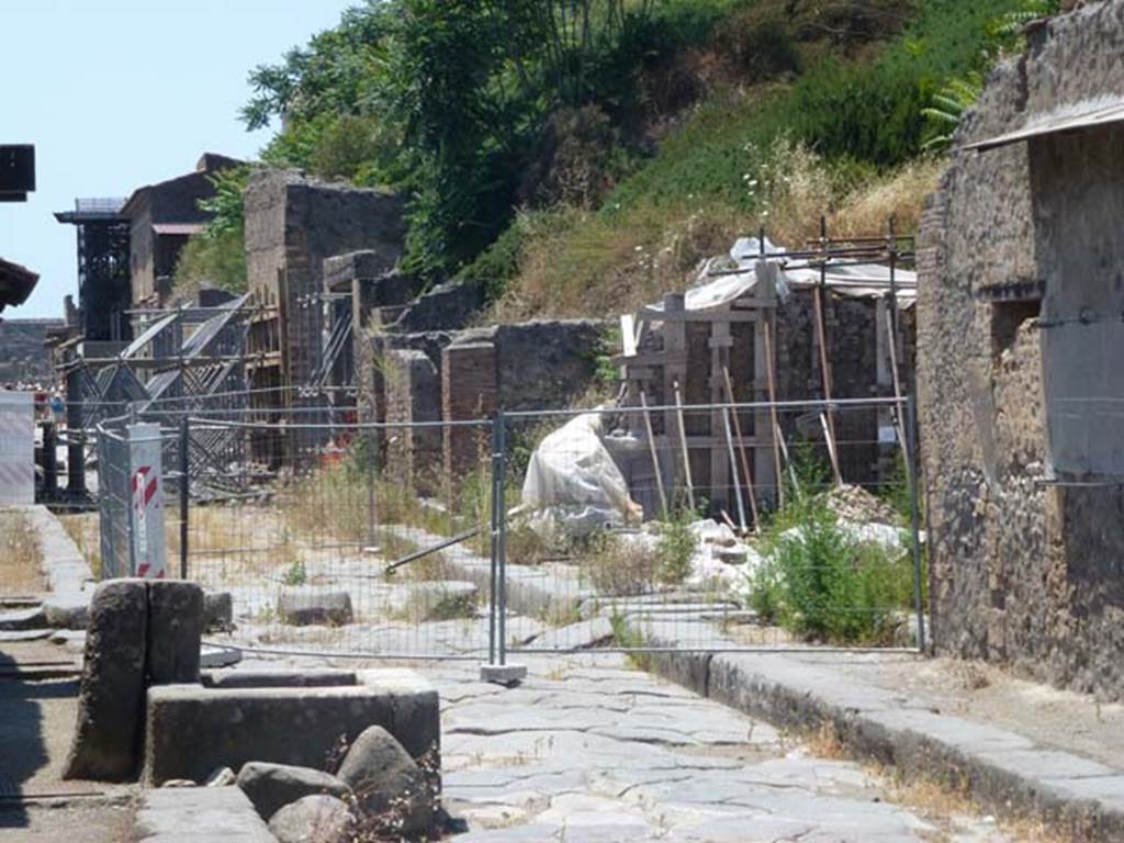 III.4.1 Pompeii, on right. June 2012. Looking west along Via dell’Abbondanza with site of III.4.1 on its north side, on the right. Photo courtesy of Michael Binns.