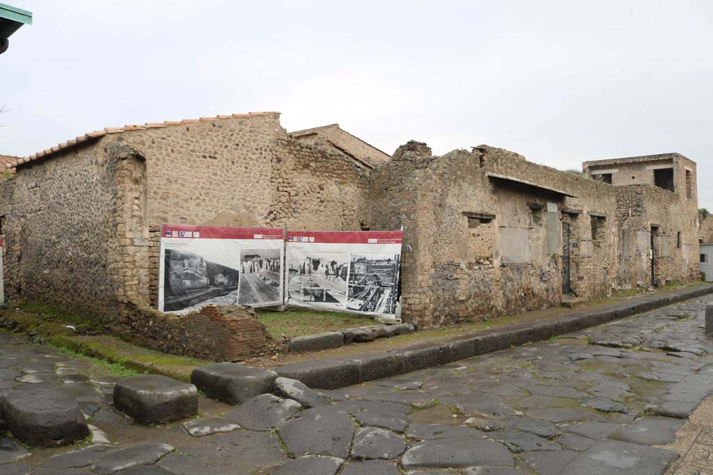 III.4.1 Pompeii, on right. Vicolo di Ifigenia, on left. April 2019. Looking north towards entrance threshold. 
The west wall, on left, has not been restored. Photo courtesy of Rick Bauer.
