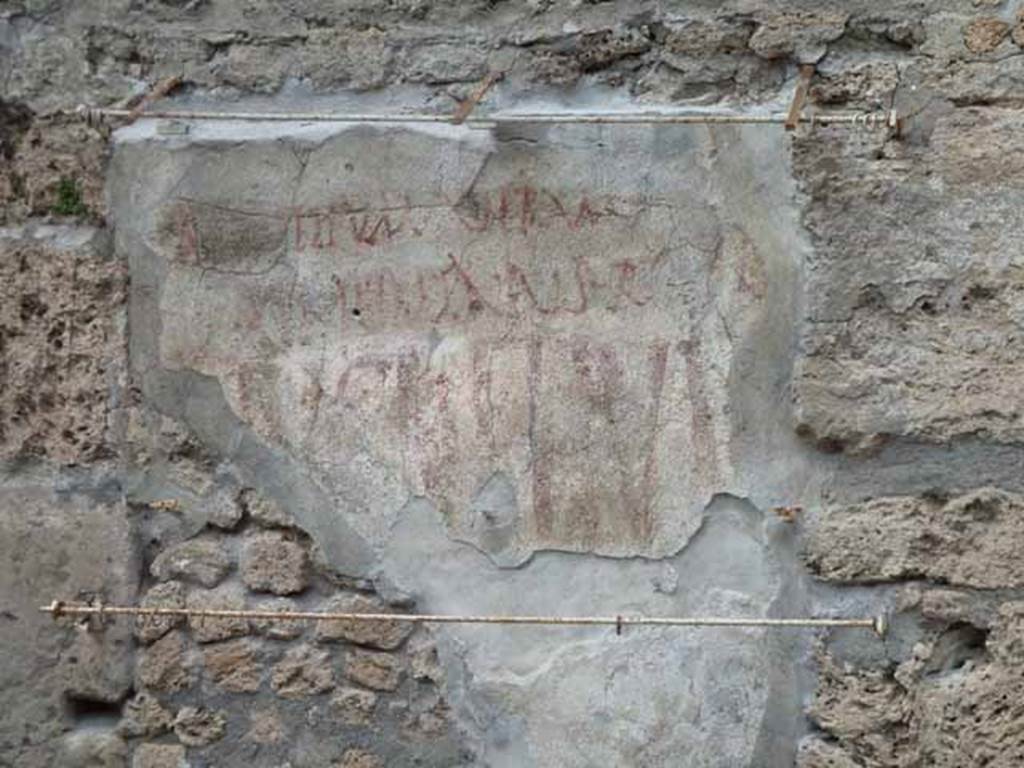 III.4.3 Pompeii. May 2010. Eituns graffiti on front fa�ade of III.4.3, on left side of entrance.