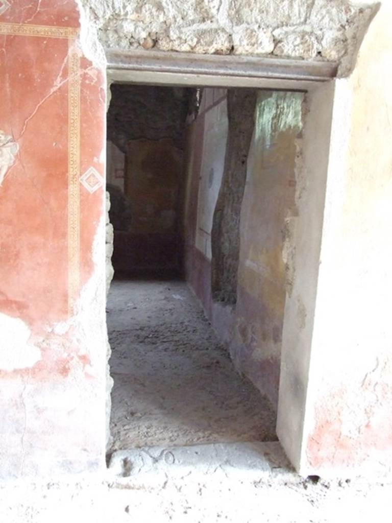 III.4.b. Pompeii. March 2009. Door to room 5, Triclinium., in east wall of room 4, Exedra.