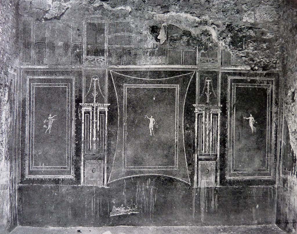 III.4.b Pompeii. Room 8, east wall of “yellow” oecus, this room may have been used to show and sell the jewellery/gems.
See Spinazzola, V. Pompei, alla luce degli Scavi Nuovi di Via dell’Abbondanza (Anni 1910-1923), Vol.2, (p.692, fig.656 and 657).
According to Kuivalainen –
“In the central panel, an almost naked Bacchus with thyrsus, depicted as a floating figure, larger than the floating figures on both side fields.
He gives special attention to the chalice which is quite rare.”
See Kuivalainen, I., 2021. The Portrayal of Pompeian Bacchus. Commentationes Humanarum Litterarum 140. Helsinki: Finnish Society of Sciences and Letters, (p.95-96, B2).