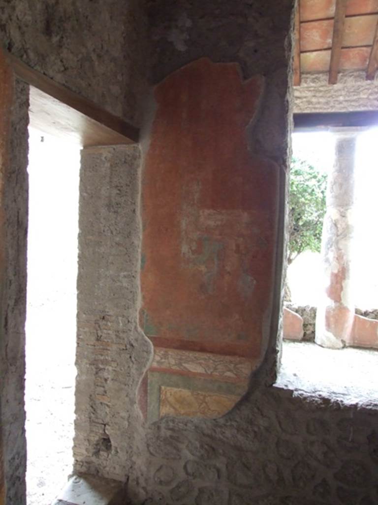 III.4.b Pompeii. March 2009. Room 3, oecus. East side of window on south wall with remains of a wall painting of a Hermaphrodite grooming before a mirror.