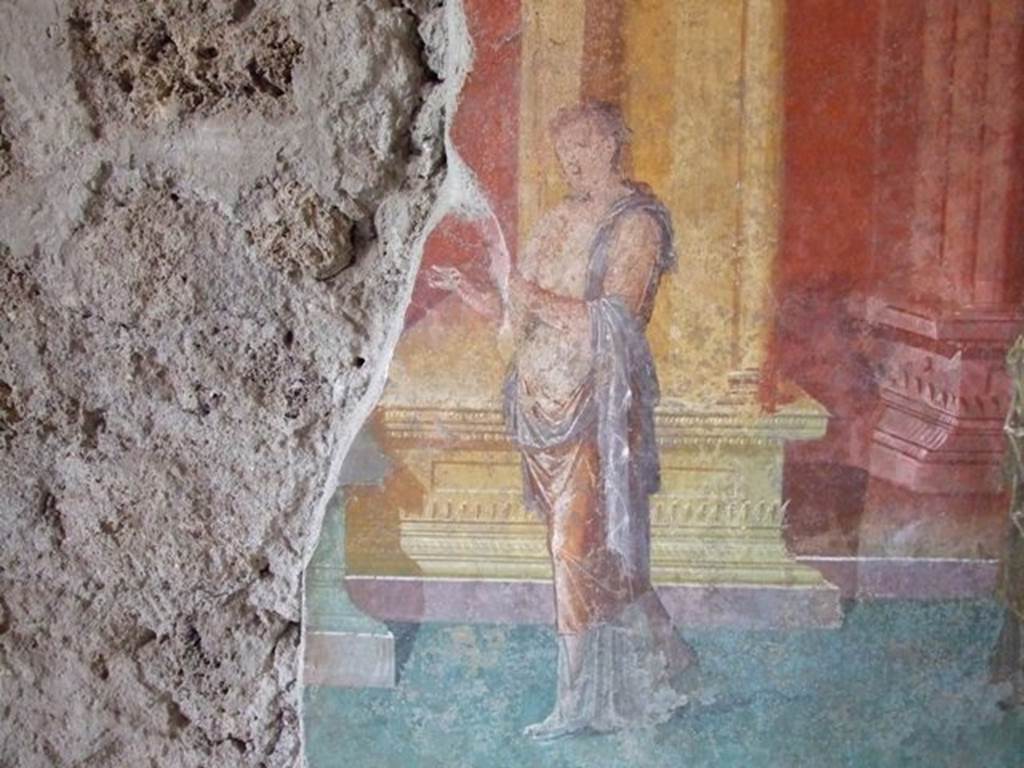 III.4.b. Pompeii. March 2009. Room 3. Oecus. West wall. Detail of wall painting of figure.