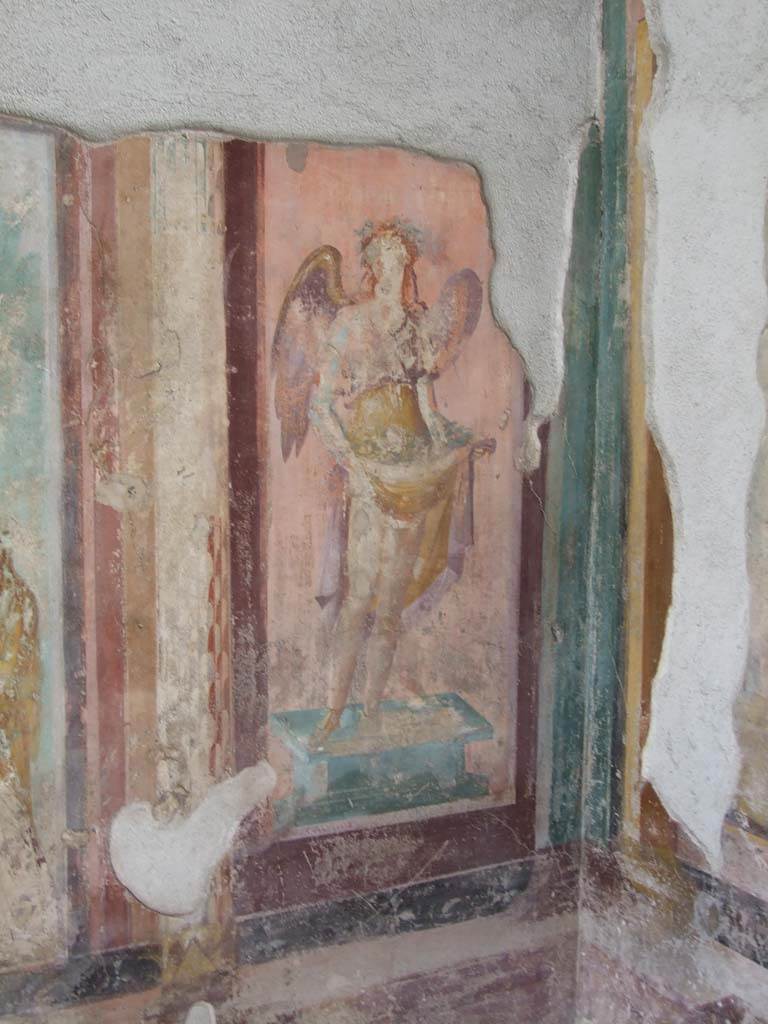 V.1.18 Pompeii. March 2009. West wall of exedra “y”, north end.
Wall painting of a winged figure possibly a muse.
See Leach, E.W., 2004. The Social Life of Painting in Ancient Rome and on the Bay of Naples. Cambridge UK: Cambridge UP. (p.135).