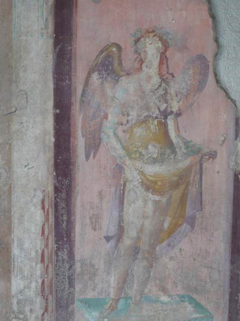 V.1.18 Pompeii. May 2012. West wall of exedra “y”, north end. Detail of wall painting of a winged figure possibly a muse. Photo courtesy of Buzz Ferebee.