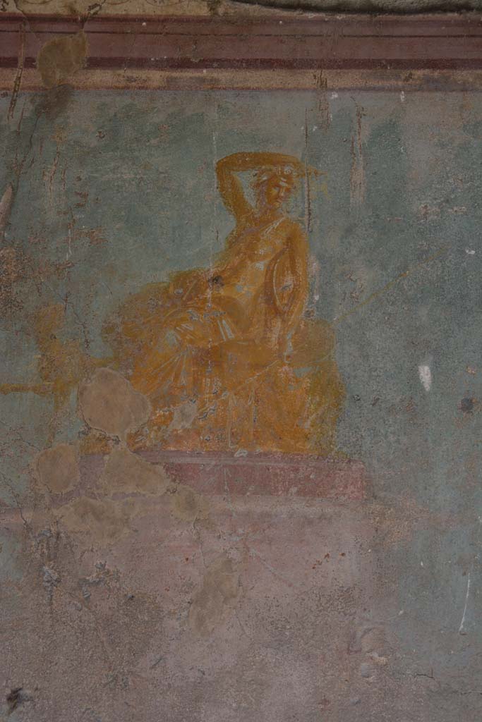 V.1.18 Pompeii. October 2019.
Exedra “y”, painting of golden seated figure in centre of east wall of exedra “y”, described as both Dionysus, or perhaps Arianna.
Foto Annette Haug, ERC Grant 681269 DÉCOR.