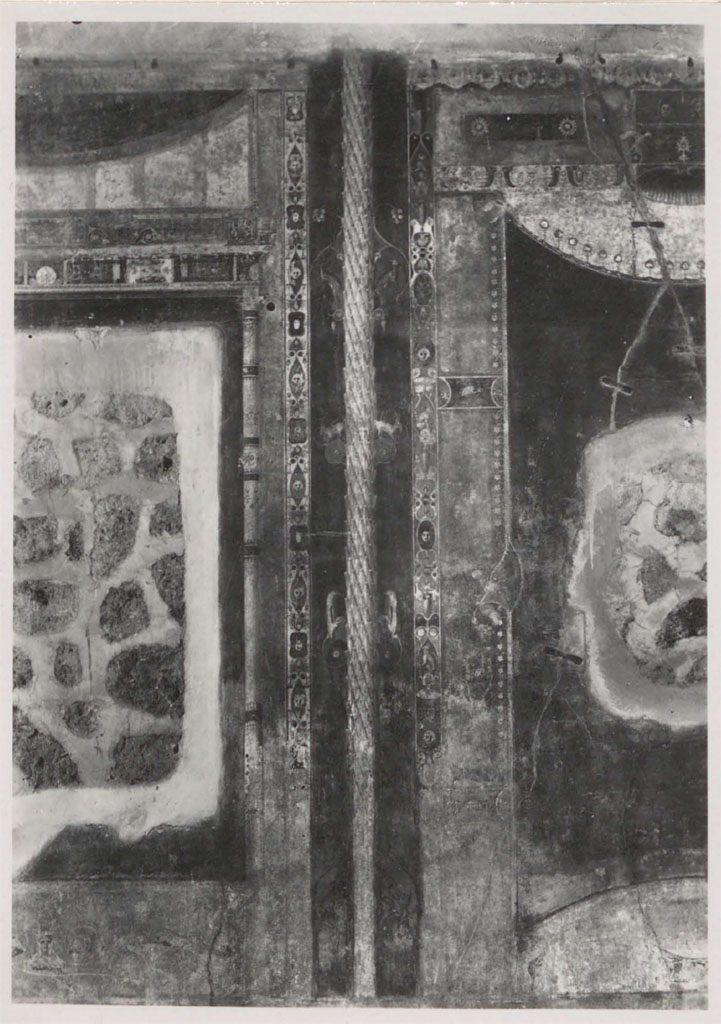 V.1.26 Pompeii. 1931. Room "i", detail from the north wall.
According to Warscher –
“The holes remain after the paintings have been transferred to the Museum.
The ornaments left in situ deserve attention because they are among the finest of the Third style.
As for the side panels – you can clearly see that they represented curtains.
As far as I know this is the only example of the Third style where curtains are represented.
If it were not for this example so characteristic of the Third style, (just look at the ornaments!), I would have said that the curtains are found only in the Fourth style, but this example prevents me from doing this generalization.
See Warscher, T. 1942. Catalogo illustrato degli affreschi del Museo Nazionale di Napoli. Sala LXXIX. Vol.1. Rome, Swedish Institute
DAIR 31.1748. Photo © Deutsches Archäologisches Institut, Abteilung Rom, Arkiv.
(I buchi rimasti dopo che le pitture sono state trasferite nel Museo.
Gli ornamenti rimasti in situ meritano attenzione perche sono fra i piu fini del terzo stile.
Quanto ai pannelli laterali – si vede chiaramente che rappresentavano delle cortine.
Per quanto io sappia questo era l’unico esempio del terzo stile dove sono rappresentate cortine.
Se non fosse questo esempio cosi caratteristico del terzo stile, (basta vedere gli ornamenti!), io avrei detto che le cortine si riscontrano solamente nel quarto stile, ma proprio questo esempio mi impedisce di fare questa generalizzazione.)