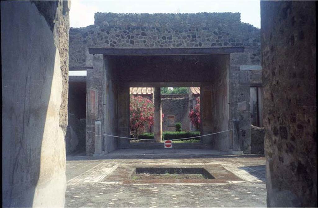 V.1.26 Pompeii. July 2011. Room “a”. Looking east from entrance, through fauces to atrium. Photo courtesy of Rick Bauer. According to Niccolini, two herms were found, one on either side of the tablinum.
The one on the left was taken to the Naples Archaeological Museum, see below.
While the other herm, on the right, which was still in situ, had its head destroyed by later burrowers or diggers, after the eruption.
See Niccolini F, 1890. Le case ed i monumenti di Pompei: Volume Terzo. Napoli, (page 1 of La Casa del Banchiere L. Cecilio Giocondo).
