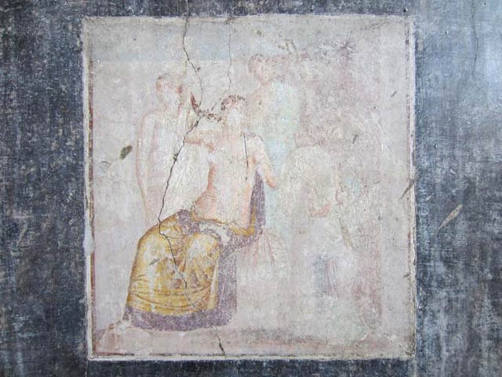 V.4.a Pompeii. March 2012. Cubiculum on south side of atrium, east wall. Wall painting of the Toilet of Venus or the Toilette of Aphrodite. Photo courtesy of Marina Fuxa.