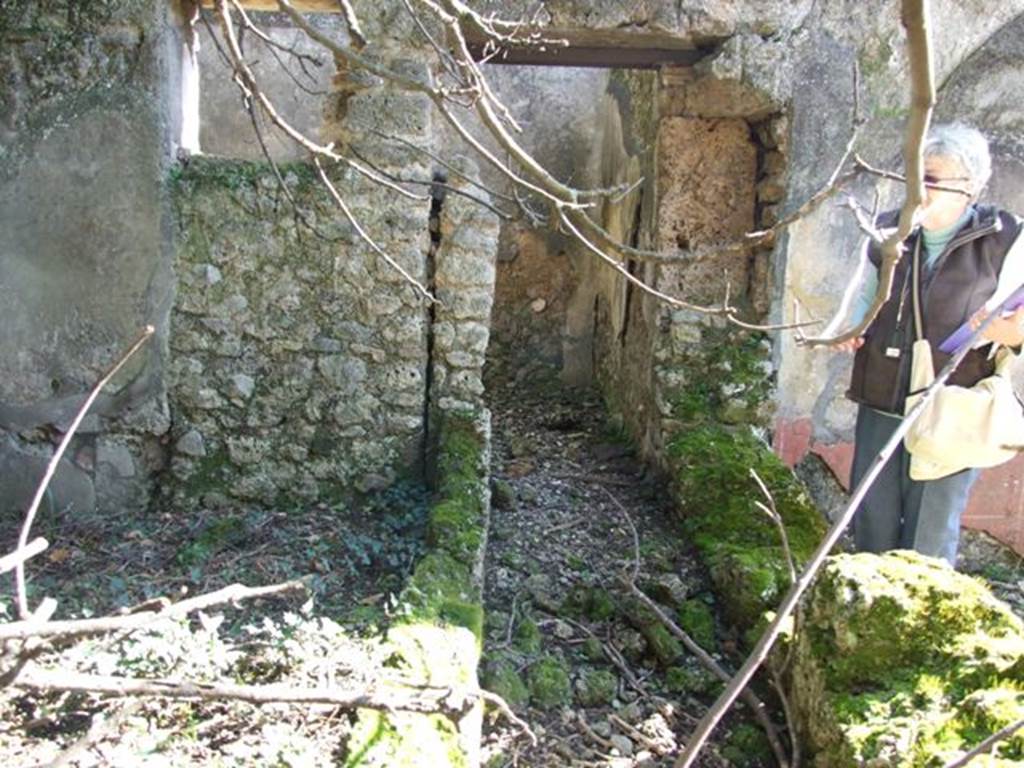 V.4.c Pompeii. March 2009. Room K, looking south along west ambulatory. South wall of garden area, and window and doorway to kitchen, room M.