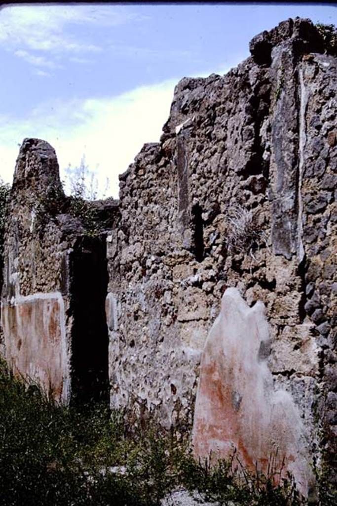 V.4.c Pompeii. 1964. Front street wall and entrance doorway, with painted plaster on the east side of Vicolo di Lucrezio Frontone. Photo by Stanley A. Jashemski.
Source: The Wilhelmina and Stanley A. Jashemski archive in the University of Maryland Library, Special Collections (See collection page) and made available under the Creative Commons Attribution-Non Commercial License v.4. See Licence and use details.
J64f1227