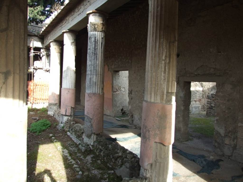 VI.1.7 Pompeii. December 2007. East side of room 13, the Peristyle.
According to Jashemski, the peristyle garden was enclosed on all four sides by a portico. It was supported on the west, east and south by twelve stuccoed columns, smooth below and fluted above. In the middle of the garden were two large adjacent pools, the interiors of both were painted blue. The south pool was rectangular in shape and had steps leading into it on the east side. The north pool which is square had much of its space occupied by a massive masonry square, which probably supported a large fountain statue. See Jashemski, W. F., 1993. The Gardens of Pompeii, Volume II: Appendices. New York: Caratzas. (p.119)