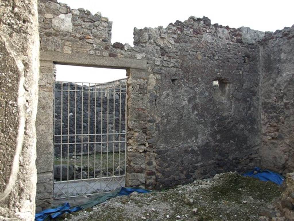 VI.1.7 House of the Vestals. Room 32 with rear entrance VI.1.24.