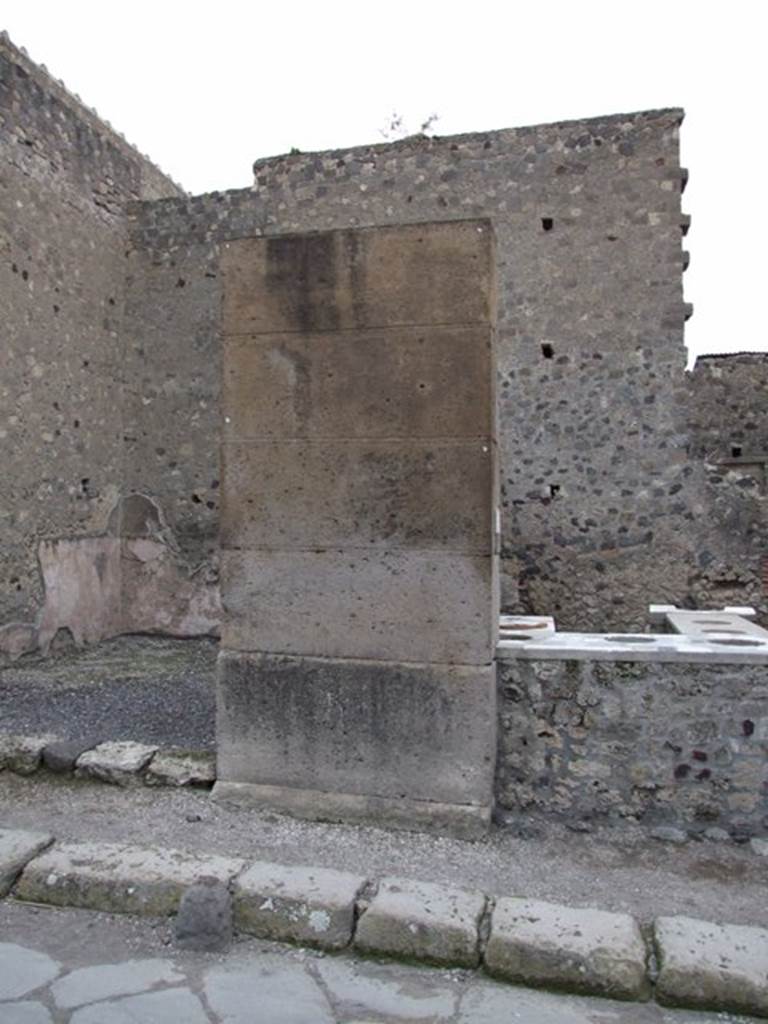 VI.2.2 Pompeii. Shop. December 2007. Pilaster on Via Consolare between VI.2.1 and VI.2.2. Possible site of Eituns?