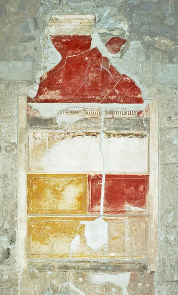 VI.2.4 Pompeii. October 2001.
Detail of wall decoration on north side of atrium, between doorways to the anteroom of the winter triclinium, and a cubiculum.
Photo courtesy of Peter Woods.