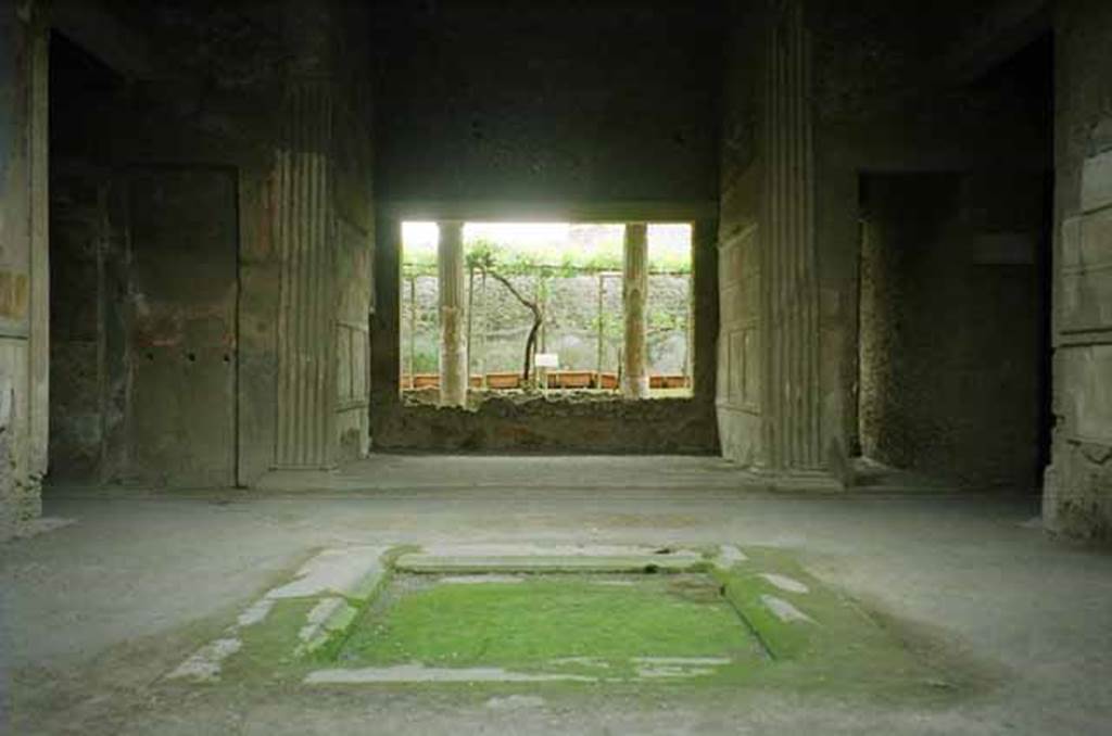 VI.2.4 Pompeii. May 2010. Looking east across atrium. Photo courtesy of Rick Bauer. Apart from the west side, the house was entirely destroyed by the bombing during the night of 14/15th September 1943. The roof, the south apartment, and the portico behind the main house block are almost completely modern reconstructions made in 1970-71. See Garcia y Garcia, L., 2006. Danni di guerra a Pompei. Rome: L’Erma di Bretschneider. (p. 66-74)