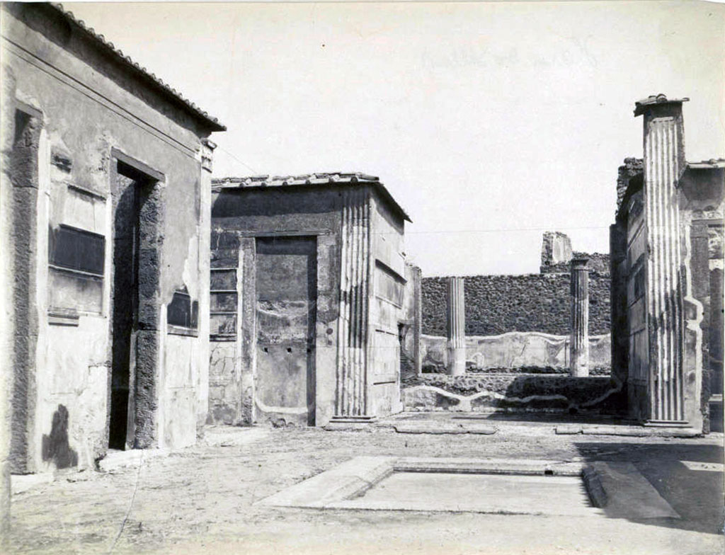 VI.2.4 Pompeii. Old undated photograph of 1870s. Looking east across atrium, the north ala is seen, centre left.