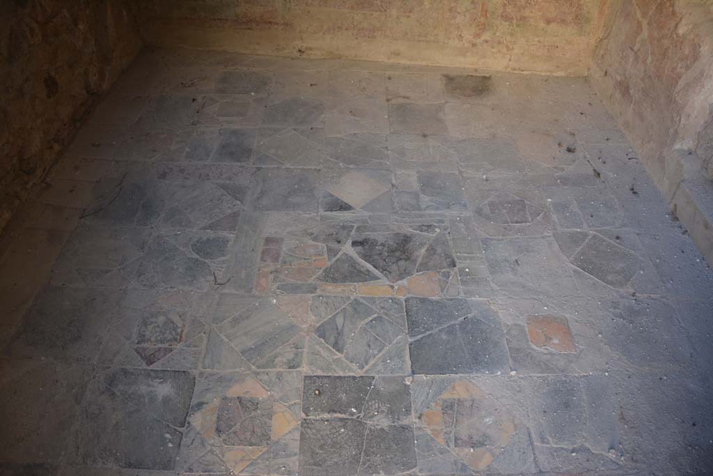 VI.2.4 Pompeii. December 2017. Looking south across flooring of opus sectile.
Foto Annette Haug, ERC Grant 681269 DÉCOR.
According to Laidlaw –
“This room (Diaeta 34) was badly damaged by the bomb; when the debris was cleared at the end of the war, the left (East) and entrance (North) walls were partly rebuilt, and the room reroofed. The pavement in opus sectile, which the blast had shattered, was restored approximately in the pattern of the original, with the missing parts filled in with cement or stray pieces found in the debris.”
See Laidlaw, A., and Stella M. S., 2014. The House of Sallust in Pompeii (VI.2.4): JRA 98. Portsmouth Rhode Island. (p.111).
See Carratelli, G. P., 1990-2003. Pompei: Pitture e Mosaici. IV. Roma: Istituto della enciclopedia italiana, (p. 136-7, figs 84a, and 84b.)