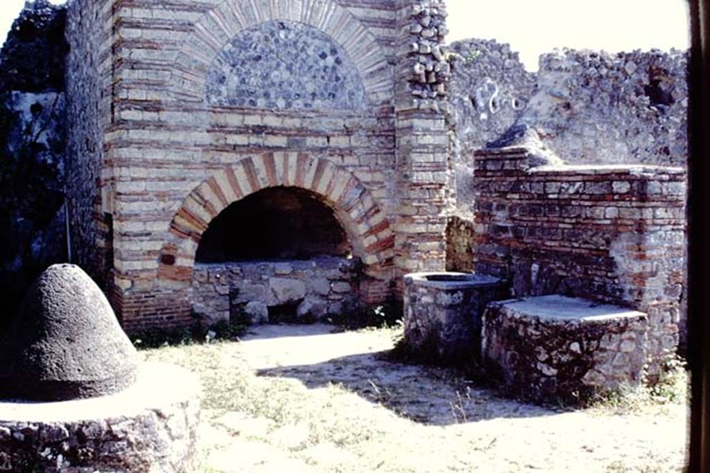 VI.3.3 Pompeii. 1968. Room 7, looking south across mill-room towards oven. Photo by Stanley A. Jashemski.
Source: The Wilhelmina and Stanley A. Jashemski archive in the University of Maryland Library, Special Collections (See collection page) and made available under the Creative Commons Attribution-Non Commercial License v.4. See Licence and use details.
J68f1983