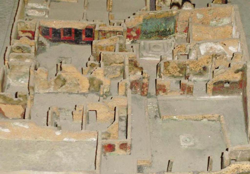 VI.7.23 Pompeii. Model of Casa di Apollo (from Naples Archaeological Museum). Photo courtesy of Davide Peluso. The fountain with the garden painting on the wall behind it can be seen in the top right-hand corner. The entrance and atrium are seen in the top left-hand corner.