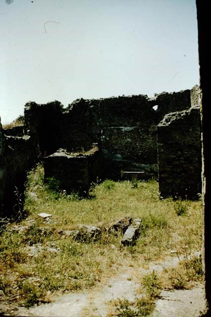 VI.7.23 Pompeii. 1957. Looking west across site of fountain towards doorway to storeroom and to triclinium, on right with table. Photo by Stanley A. Jashemski.
Source: The Wilhelmina and Stanley A. Jashemski archive in the University of Maryland Library, Special Collections (See collection page) and made available under the Creative Commons Attribution-Non Commercial License v.4. See Licence and use details.
J57f0343