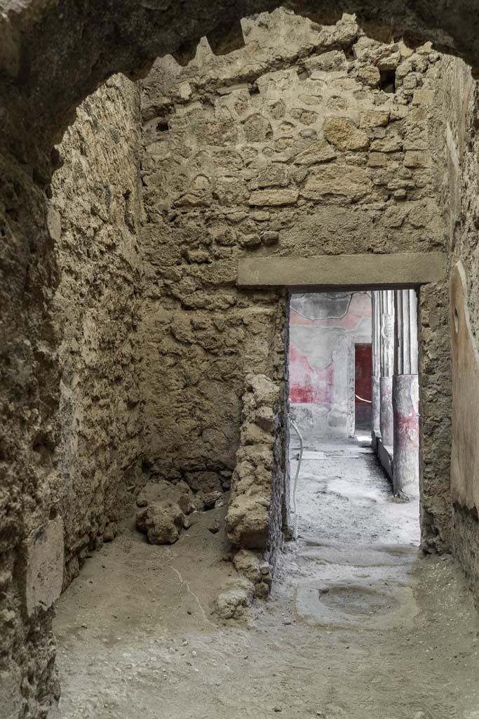 VI.8.3/5 Pompeii. April 2022.
Room 13, looking west towards latrine, on left, near doorway to peristyle.
Photo courtesy of Johannes Eber.