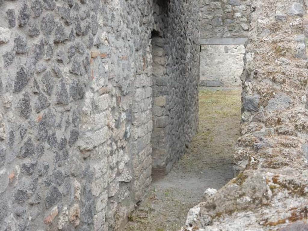 VI.8.22 Pompeii. May 2017. Looking west to lower level and doorway of room 7.
Photo courtesy of Buzz Ferebee.