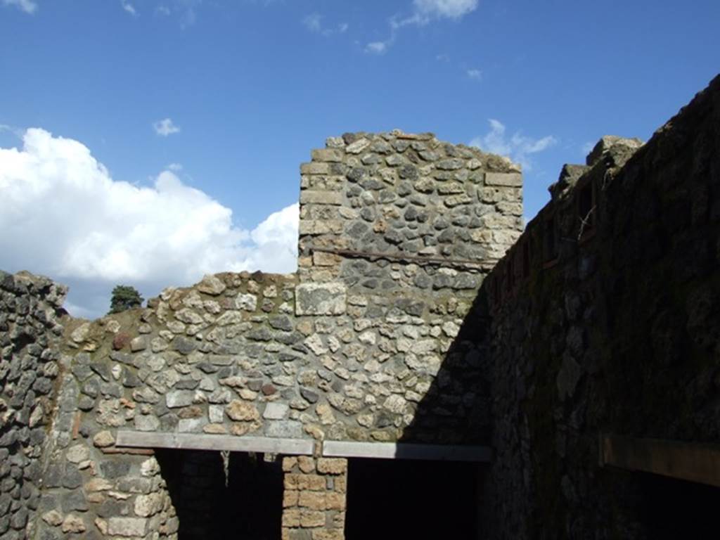 VI.8.22 Pompeii. March 2009. Room 10. Kitchen area, looking east to door to corridor and the other to room 7, and wall for upper floor.