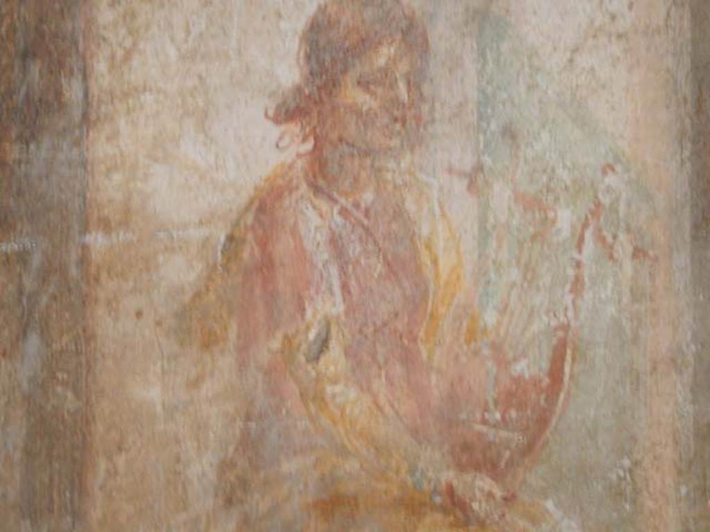 VI.8.23 Pompeii. May 2017. Detail of painted figure from west end of upper north wall. Photo courtesy of Buzz Ferebee.