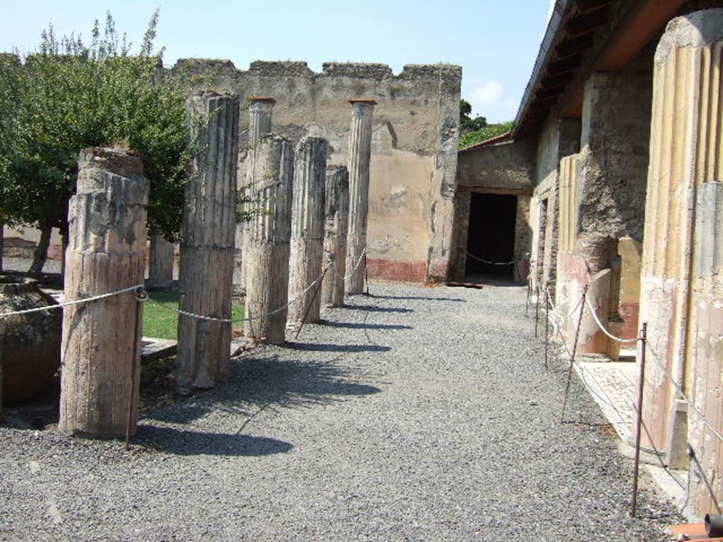 VI.9.2 Pompeii. September 2004. Peristyle. East side. Looking north towards room 28.