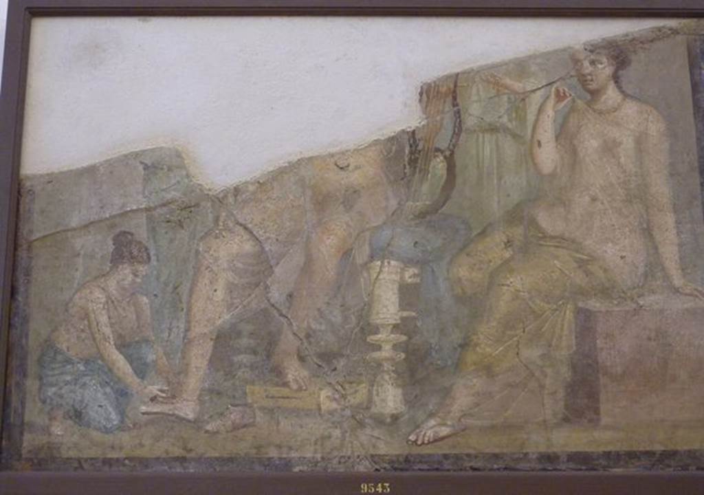 VI.9.2 Pompeii. Found 22nd September 1829 on west end of south wall of room 2, atrium.
Wall painting of a servant putting the shoes on a man with a lyre. A woman sits at his side and other figures stand in the background. Now in Naples Archaeological Museum. Inventory number 9543. According to Overbeck-Mau, this painting might have been of Paris and Helen.
See Overbeck J., 1884. Pompeji in seinen Gebäuden, Alterthümen und Kunstwerken. Leipzig: Engelmann. (p.309)
See Helbig, W., 1868. Wandgemälde der vom Vesuv verschütteten Städte Campaniens. Leipzig: Breitkopf und Härtel. (1386b).
