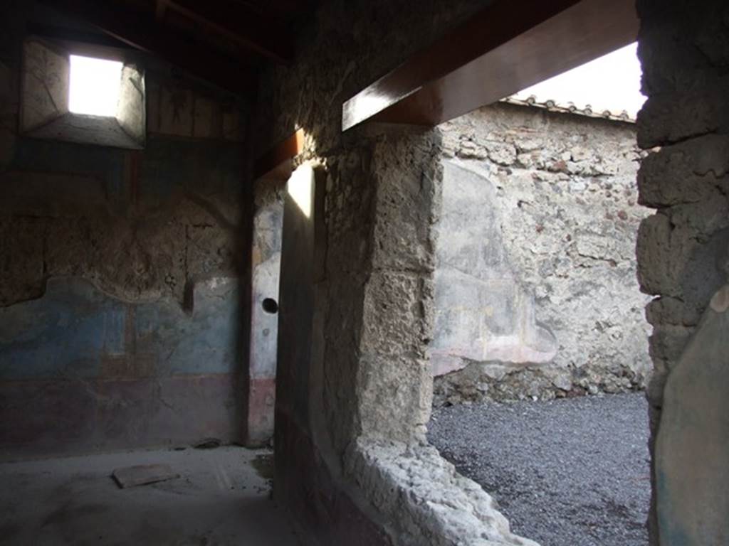 VI.9.2 Pompeii. December 2007. Room 29. North wall with window and door overlooking peristyle.