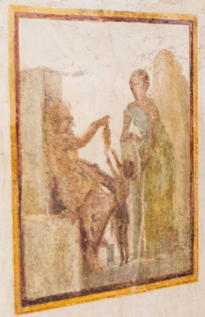 VI.9.6 Pompeii. January 2023. Room 21, restored wall painting on south wall of Silenus offering the child Bacchus a bunch of grapes.
Detail from photo courtesy of Johannes Eber.