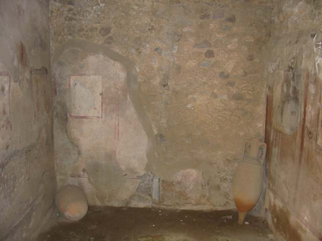 VI.10.1 Pompeii. May 2003. Fresco on north wall of rear room.  Remains of painting of cart delivering wine, the mules are resting unharnessed. Photo courtesy of Nicolas Monteix.
