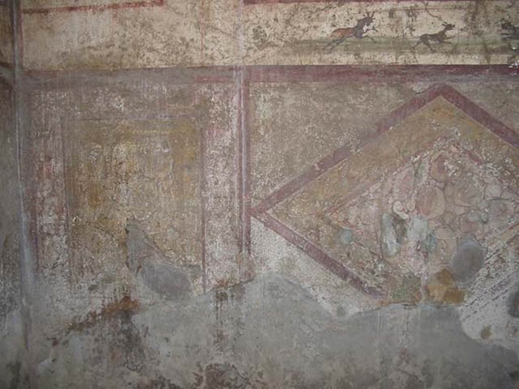 VI.10.1 Pompeii. May 2003. Painted lower north wall with hunting scene. Photo courtesy of Nicolas Monteix.