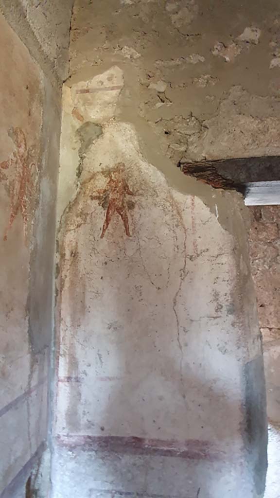 VI.10.1 Pompeii. July 2021. 
Painted cupid on west wall in south-west corner, with doorway, on right.
Foto Annette Haug, ERC Grant 681269 DCOR.

