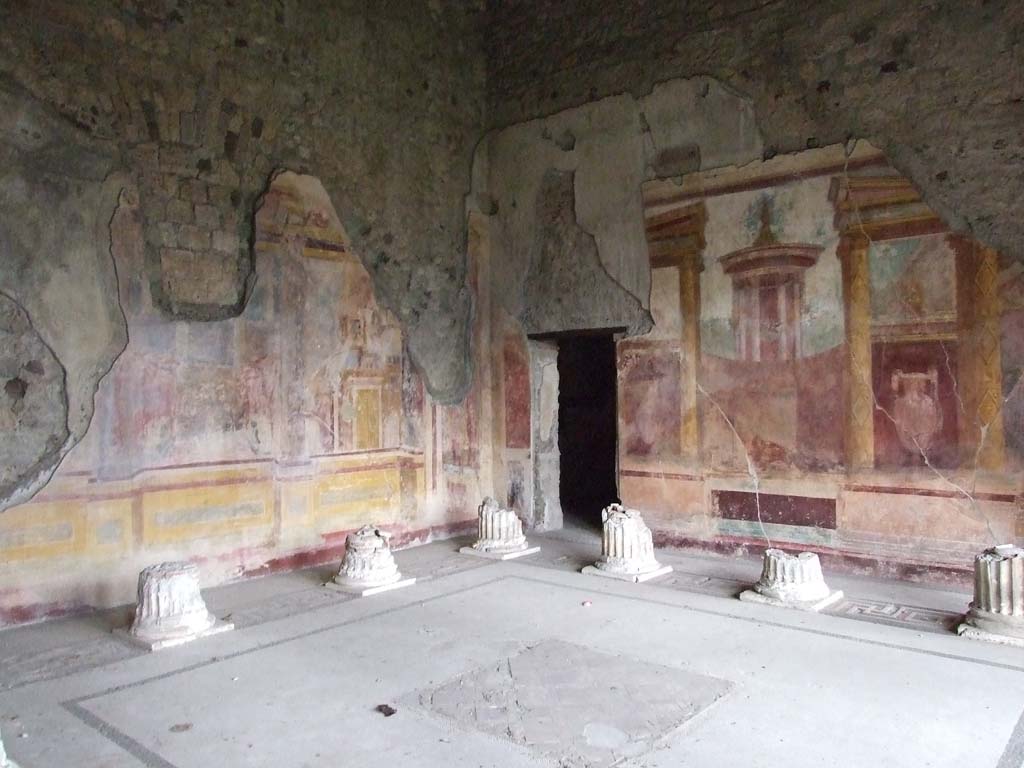 VI.11.10 Pompeii. December 2006. Room 43, looking north-east across Corinthian oecus.
Remains of columns, painted walls and doorway to room 45 in north-east corner.