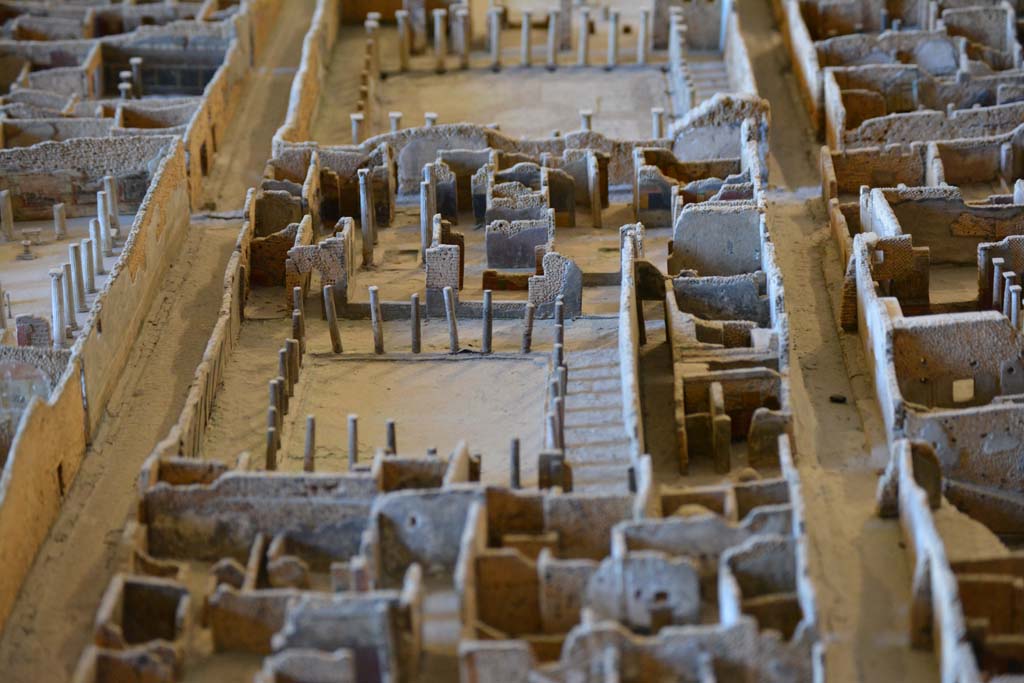 VI.11.9/10 Pompeii. July 2017. Looking south across peristyle, in centre, towards two entrance doorways on north side of Vicolo di Mercurio.
At the top is the peristyle of VI.11.12, House of the Faun, on south side of Vicolo di Mercurio.
From cork model in Naples Archaeological Museum.
Foto Annette Haug, ERC Grant 681269 DÉCOR.