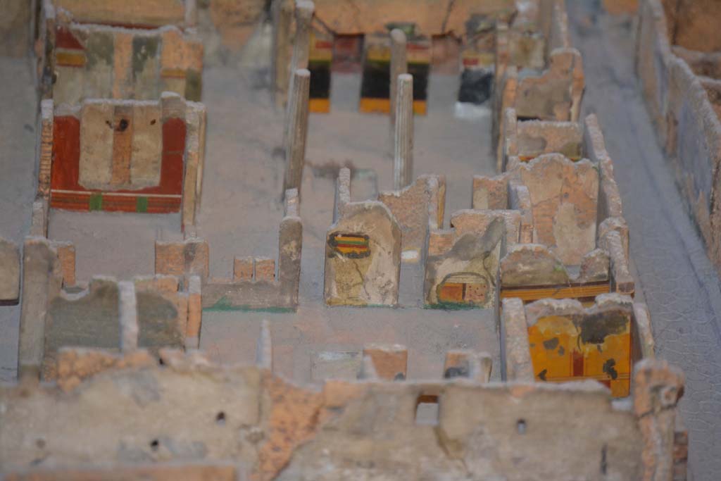 VI.11.9/10 Pompeii. July 2017. Looking east with atrium 3 in centre, and atrium 27, above it.
In the east wall of atrium 3, the yellow/green/red striped upper wall between corridor 48, and room 29, can be seen as well as the painted lower wall in south-east corner.
The yellow wall (next to Vicolo di Mercurio) is the east wall of room 5.
On the left side of the photo is the red east wall of room 35.
At the rear of room 35 is the east wall of tablinum 33.
In the upper centre is the black/yellow wall of the east wall of atrium 27.
From cork model in Naples Archaeological Museum.
Foto Annette Haug, ERC Grant 681269 DÉCOR.