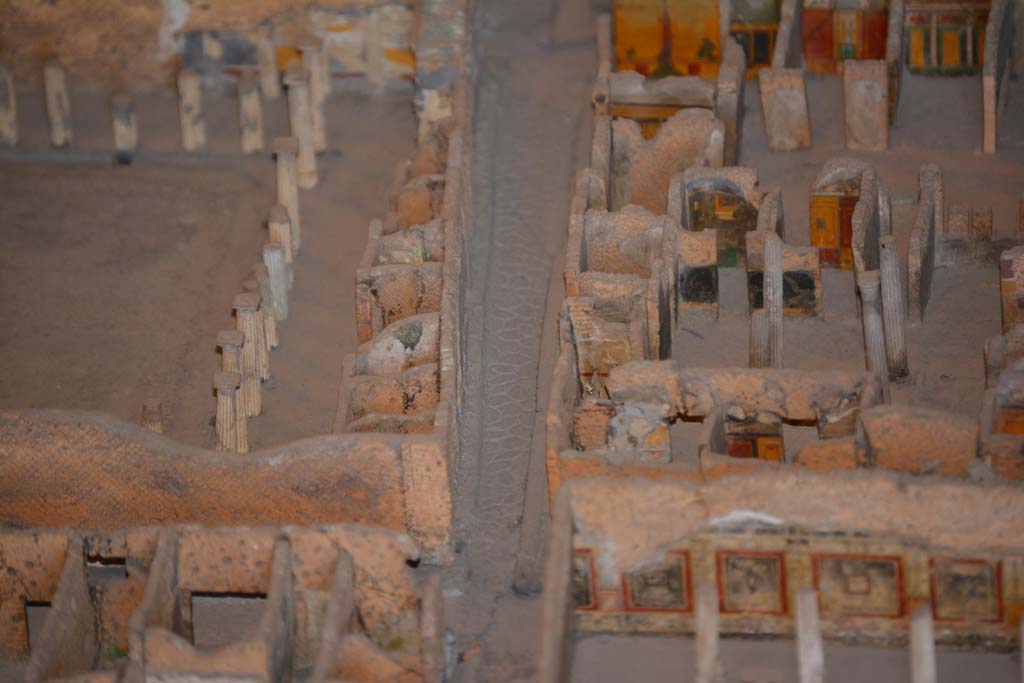 VI.11.9/10 Pompeii. July 2017.
On the right, across the centre, rooms on the west side of atrium 27 features the black painted room 28, the yellow/red painted room 29, undecorated corridor 48, and room 31, west ala.
From cork model in Naples Archaeological Museum.
Foto Annette Haug, ERC Grant 681269 DÉCOR.