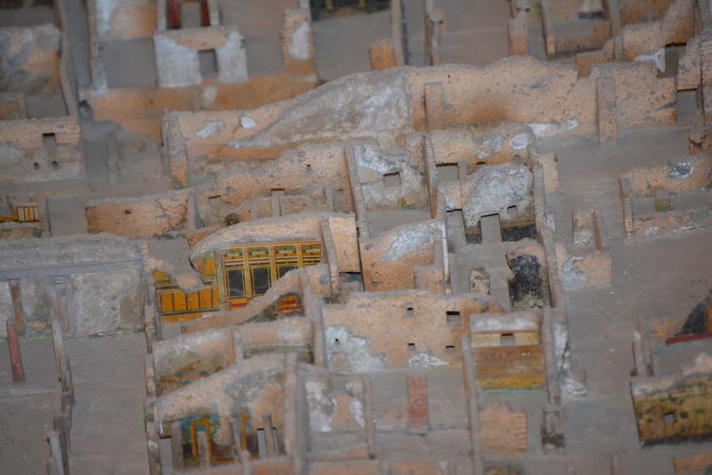 VI.11.9/10 Pompeii. July 2017. Looking west towards rooms at north end of peristyle 36.
On the left in the centre, the painted yellow/black wall of room 39 can be seen.
At the rear of it, on the right, the room 18.
On the right in the centre, the black painted walls, would appear to below to VI.11.8, and would mark the north boundary of this combined house.
From cork model in Naples Archaeological Museum.
Foto Annette Haug, ERC Grant 681269 DÉCOR