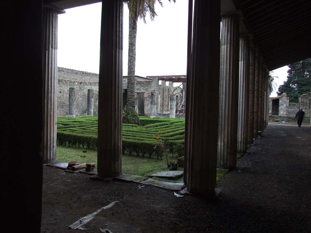 VI.11.10 Pompeii. December 2006. Looking across peristyle garden 36, from the north-west corner.
According to Jashemski, the large peristyle garden was enclosed by a portico on all sides.
The portico was supported by thirty stuccoed columns, on which numerous graffiti were written.
This peristyle was one of the largest in the city, so far found.
The portico was four metres wide.
The skeleton of a woman was found in the garden at a height of about 2.50m above the original soil level.
She had been fleeing with her jewels when she had been overcome by the falling of the lapilli.
See Jashemski, W. F., 1993. The Gardens of Pompeii, Volume II: Appendices. New York: Caratzas. (p.143).