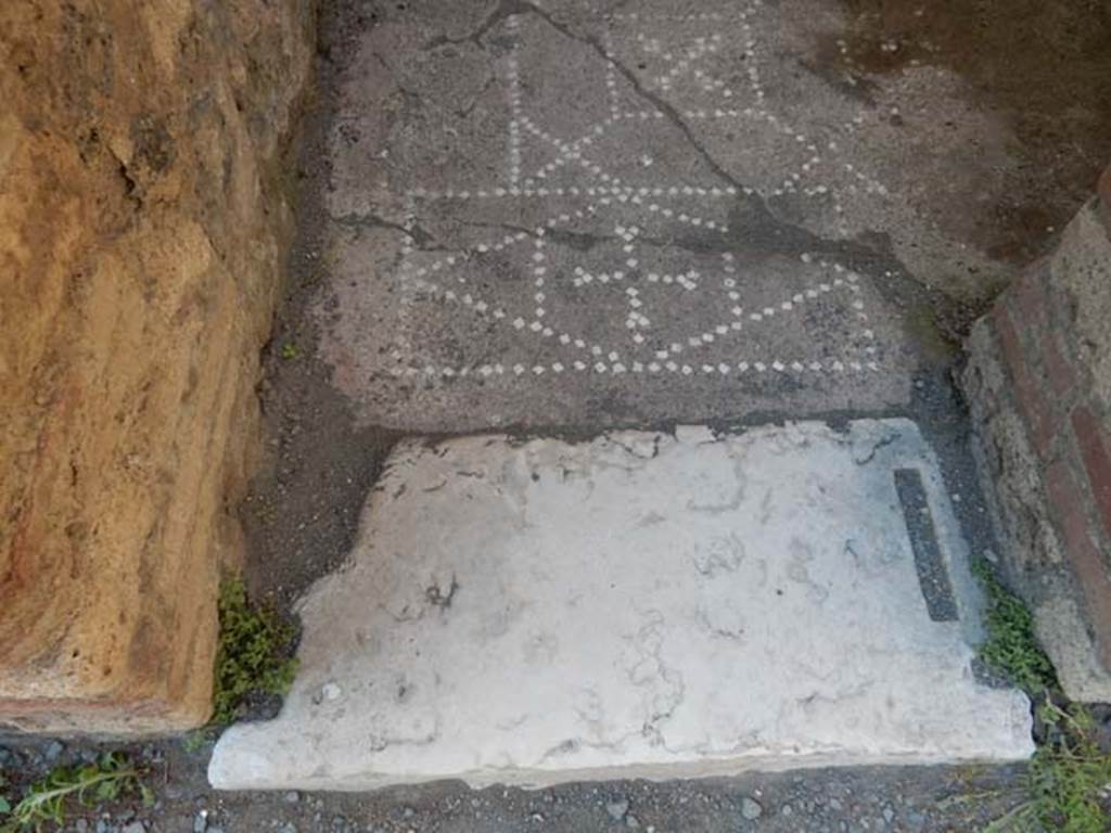 VI.12.2 Pompeii. May 2015. Doorway threshold for room in north-east corner of rear peristyle. Photo courtesy of Buzz Ferebee.