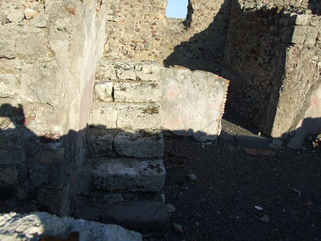 VI.12.2 Pompeii. December 2006. Looking east in room 17, another set of steps in north-east corner.