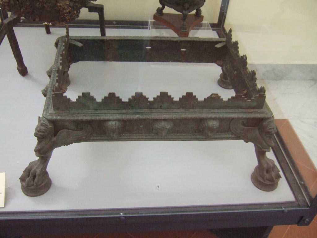 VI.12.2 or VII.9.20 Pompeii. Bronze brazier found in VI.12.2, according to card in Naples Museum.
Now in Naples Archaeological Museum. Inventory number 72991.
According to Pagano and Prisciandaro, this was found in VII.9.20, a shop, on 25th May 1822.
See Pagano, M. and Prisciandaro, R., 2006. Studio sulle provenienze degli oggetti rinvenuti negli scavi borbonici del regno di Napoli. Naples: Nicola Longobardi, (p. 124).
See Fiorelli G., 1862. Pompeianarum antiquitatum historia, Vol. 2: 1819 - 1860, Naples, p. 52-53