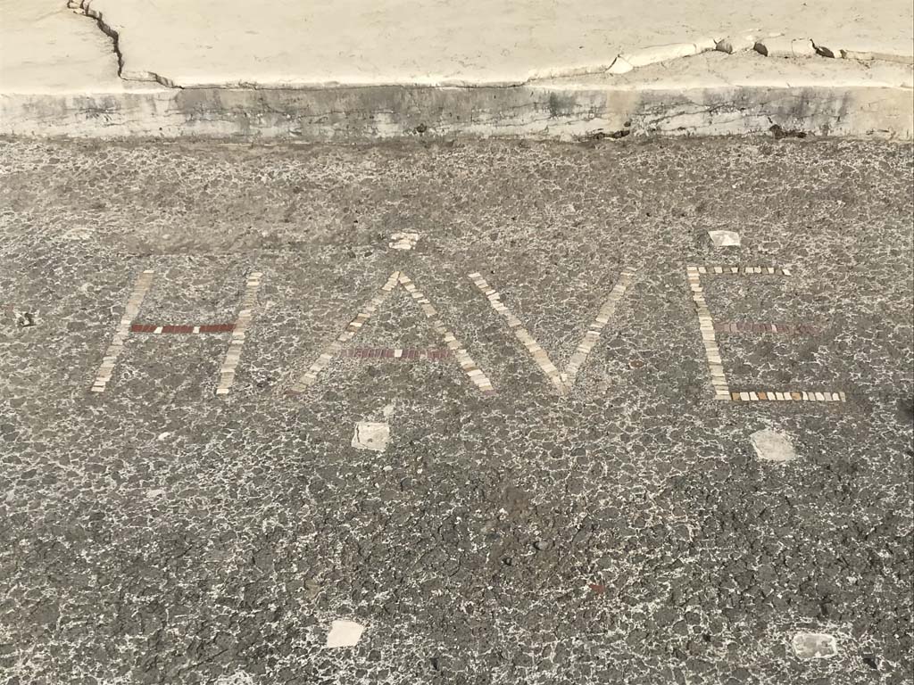 VI.12.2 Pompeii. April 2019. Wording of HAVE (Welcome) written in the pavement outside the doorway.
Photo courtesy of Rick Bauer.
