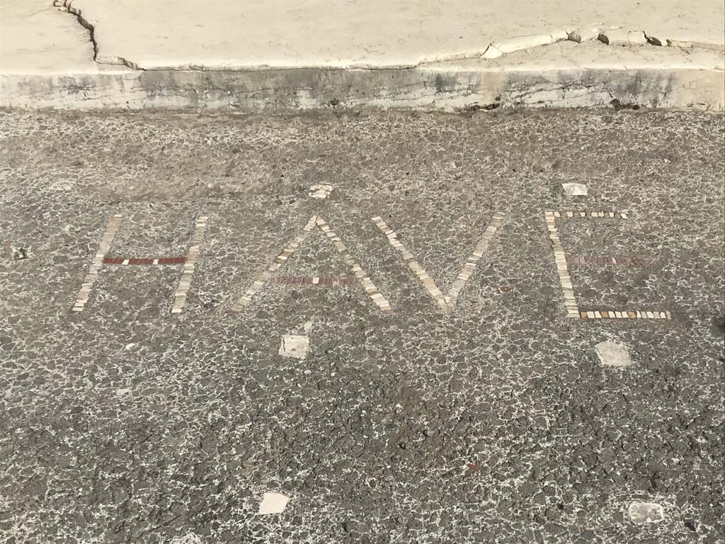 VI.12.2 Pompeii. April 2019. Wording of HAVE (Welcome) written in the pavement outside the doorway.
Photo courtesy of Rick Bauer.