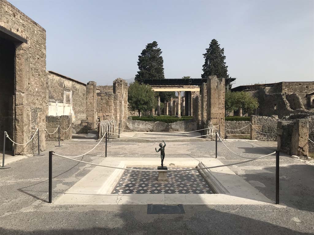 VI.12.2, Pompeii. April 2019. Looking north across impluvium in atrium towards tablinum.
Photo courtesy of Rick Bauer.