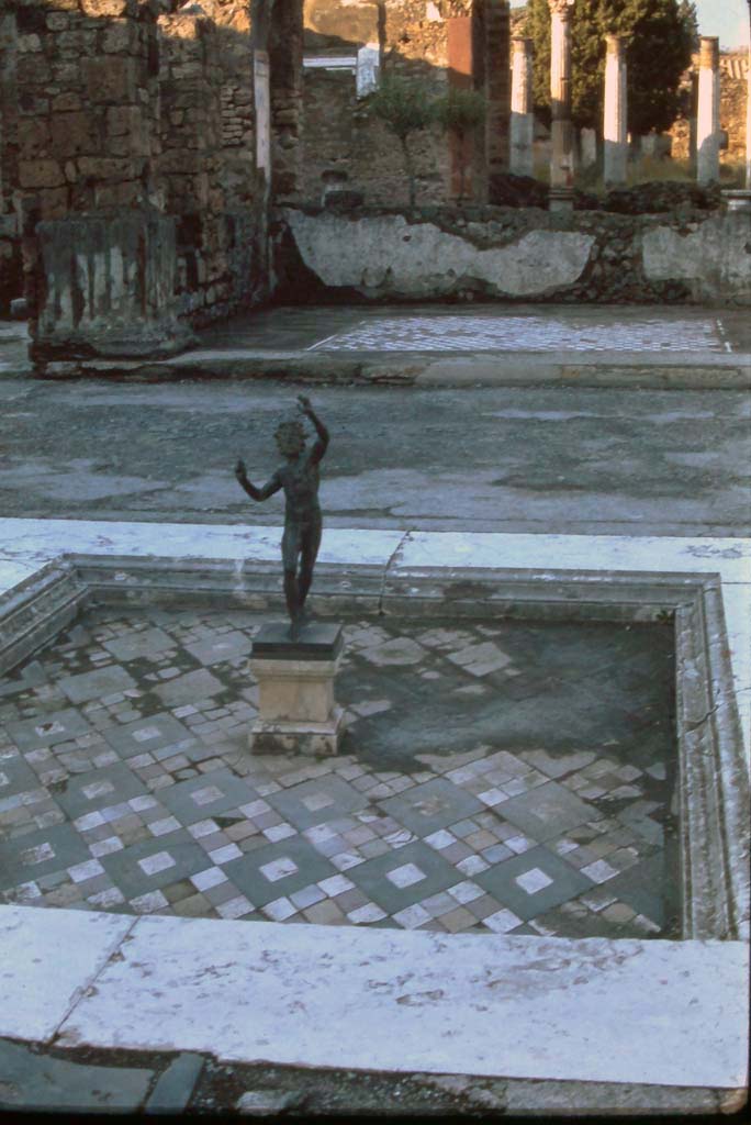 VI.12.2 Pompeii. 4th December 1971. Looking north across impluvium towards tablinum.
Photo courtesy of Rick Bauer, from Dr George Fay’s slides collection.