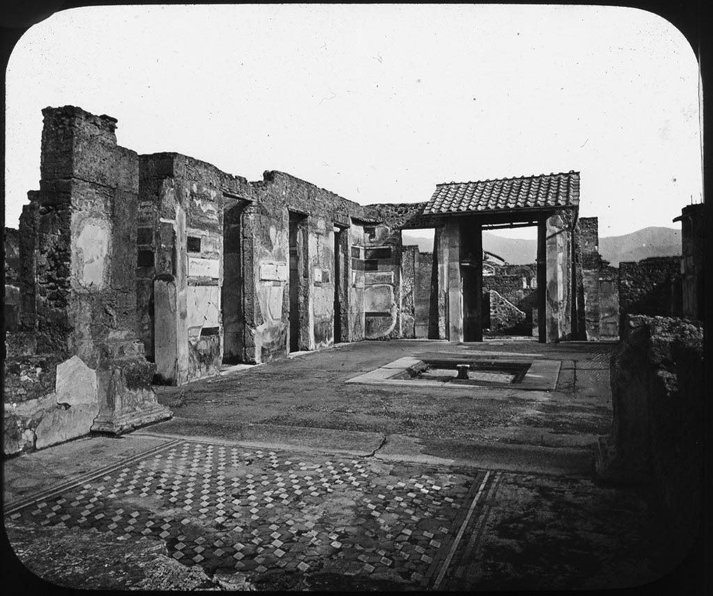 VI.12.2 Pompeii. Pre 1907 photo by George Washington Wilson.
Looking south from tablinum towards the east side of atrium, as it was prior to the 1943 bombing.
Used with the permission of the Institute of Archaeology, University of Oxford. File name instarchbx208im 128. Source ID. 44453.
See photo on University of Oxford HEIR database